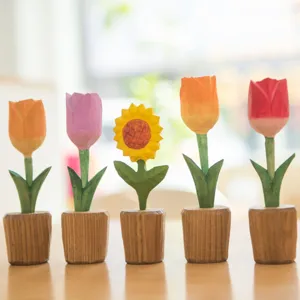 Detailed view of handcrafted wooden flower ornaments, cute tulip and sunflower decor.