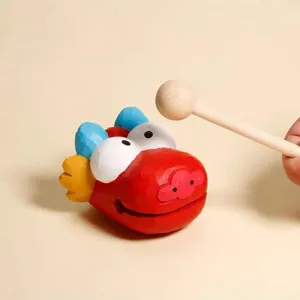 Cute wooden dragon fish sculpture desk ornament with mallet for stress relief and office decor.