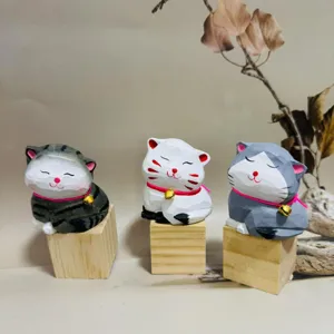 Hand-carved wooden cat figurine detail, creative animal ornament for cute desktop decor.