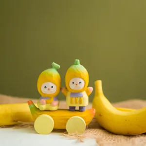 Detailed close-up of wooden banana cartoon figurines, creative desktop decoration setup.
