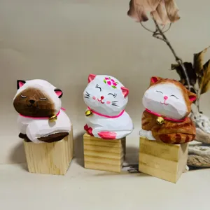 Handmade carved wooden cat figurines set, cute desktop animal ornaments for home decor and gifts.