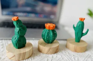 Wooden cactus figurine detail shot, natural wood display base, handmade decor item.