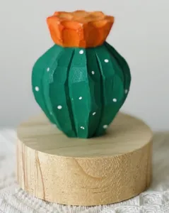 Wooden cactus ornament detail shot, creative desktop decor, natural solid wood finish.