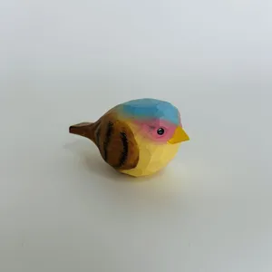 Hand-carved wooden bird figurine, colorful painted desktop decoration piece, fine woodcraft detail.