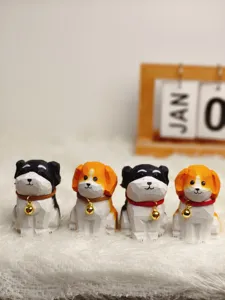 Detailed close-up of cute handmade wooden carved dog figurines with tiny bells on soft background.