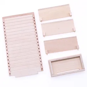 Miniature dollhouse wooden display shelf detail showing unpainted wood parts and components.