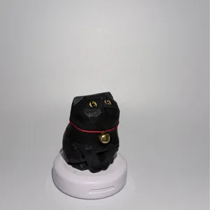 Handmade wooden black cat figurine with red collar and bell for desktop and car decoration.