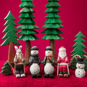 Wooden Christmas table decoration set with cute cartoon figurines and trees for festive holiday.