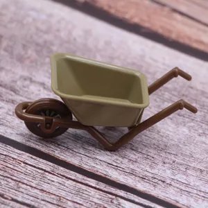 Dollhouse miniature plastic wheelbarrow detail view, cute tiny farm garden tool model for dollhouse decor.