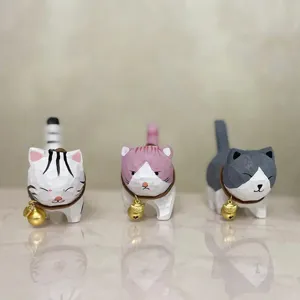 Handcrafted wooden cat figurine with cute bell desktop ornament for home office decor