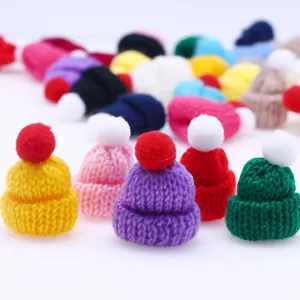 Mini knitted yarn hat detail, colorful DIY craft accessory for hair clips and miniature display.