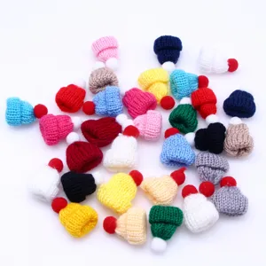 Detailed view of colorful mini knitted woolen hats, perfect for DIY hair clips and doll accessories.