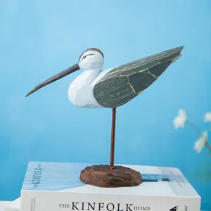 Handmade wooden bird sculpture, rustic shorebird figurine for home and office decoration.