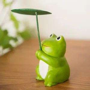 Cute wooden frog holding green leaf umbrella figurine for office desktop and home decor