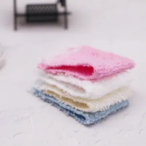 Closeup of miniature dollhouse bath towel set, cute doll bathroom decor props stacked.