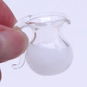 Miniature glass milk pitcher detail shot, dollhouse kitchen food play scene prop model.