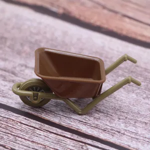 Miniature plastic wheelbarrow toy detail view for dollhouse farm tool model decor.