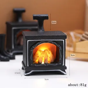 Dollhouse miniature fireplace detail view showing dimensions and warm glowing light effect.