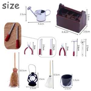 Miniature dollhouse tool set with wooden box and metal alloy accessories for DIY decor.