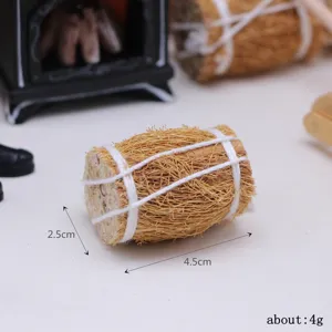 Detailed close-up view of miniature straw bale dollhouse prop, tiny hay bundle accessory.
