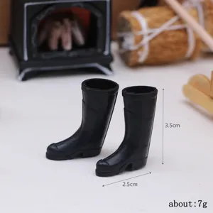 Miniature black rain boots dollhouse accessory, detailed miniature scene props display.