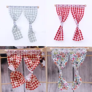 Miniature dollhouse curtain detail view showing cute floral and plaid fabric with lace trim.