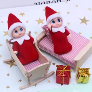 Miniature dollhouse Christmas elf dolls with wooden beds and gifts for photography props.