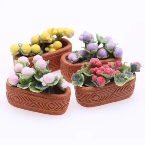 Miniature dollhouse potted plant detail showing colorful berries and textured pots.