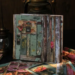 Detailed shot of vintage floral wooden door scrapbook paper, perfect for DIY journaling crafts.
