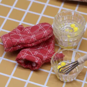 Dollhouse miniature kitchen props set including red quilted oven mitts and mini egg bowls.