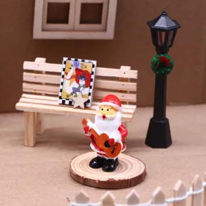 Miniature Santa Claus figurine with guitar dollhouse scene decoration detail view
