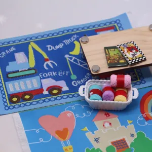 Miniature dollhouse rug detail view, cute printed construction vehicles carpet and tiny accessories.