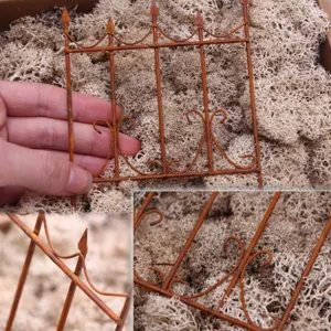Miniature rusty iron fence detail view, perfect for dollhouse fairy garden landscaping decor.
