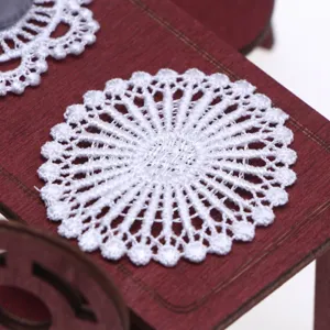 Miniature white lace doily detail shot for dollhouse table decoration and miniature display props.