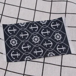 Miniature dollhouse nautical rug with anchor and wheel pattern for tiny scene decoration accessory.