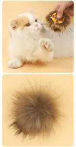 Fluffy plush cat toy with long bristles and cute cartoon patch, perfect interactive pet toy.