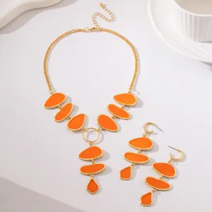 Elegant orange enamel oval pendant necklace and drop earrings jewelry set for women party.