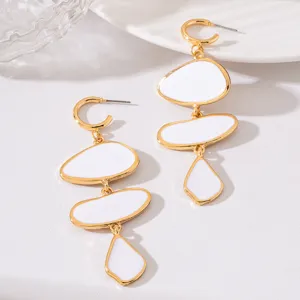 Elegant gold-plated white geometric drop earrings, chic asymmetrical pebble pendant jewelry.