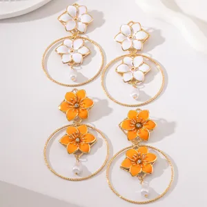 Chic enamel flower gold metal hoop dangle earrings with pearl drop for women fashion jewelry.