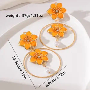 Vintage orange flower metal hoop earrings with pearls, ideal for resort vacation and stylish wear.