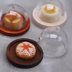 Miniature dollhouse clear plastic cake dome cover and wooden tray detail view toy food