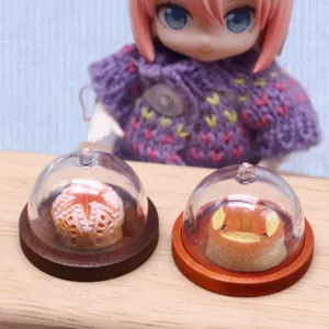 Dollhouse miniature clear plastic cake cover display dome with wooden base for doll kitchen food play.