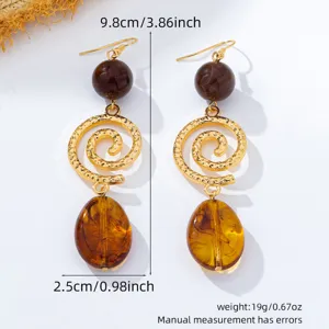 Vintage French style long amber resin spiral metal drop earrings, elegant jewelry for women.