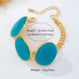 Gold-plated chain bracelet with large blue enamel oval discs, summer beach style jewelry.