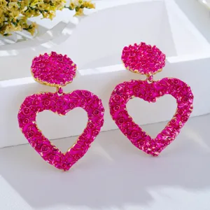 Bold textured pink heart earrings with gold trim, trendy retro statement drop jewelry for women.