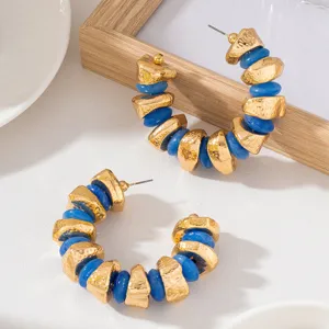 French vintage irregular textured metal blue bead hoop earrings, exaggerated C-shaped statement jewelry.