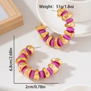 Chunky C-shaped hoop earrings with gold-textured irregular beads and purple accents.