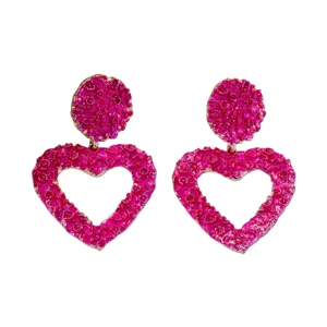 Chic hot pink textured heart drop earrings for women, trendy hollow geometric ear jewelry.
