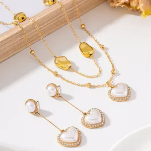 Detailed view of French retro double-layer necklace and long pearl heart earrings set.