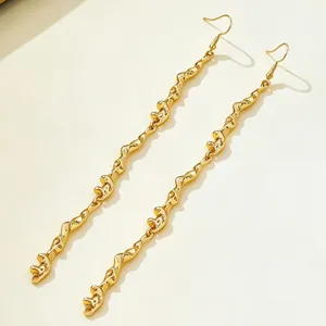 Gold molten texture irregular metal earrings, unique long wavy drop design for women jewelry.